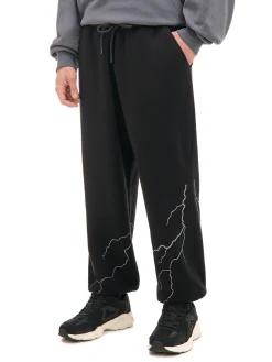 Cropp Spodnie*Dresowe joggery z odblaskowym printem czarny