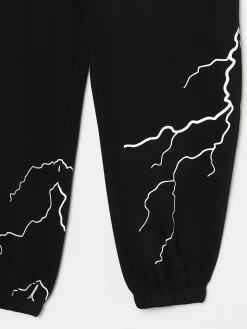 Cropp Spodnie*Dresowe joggery z odblaskowym printem czarny