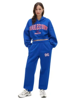 Cropp Spodnie|Sety*e dresowe joggery z naszywką niebieski